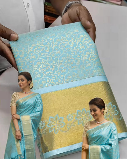 Promotional image of a saree with a woman wearing it, held by a person.